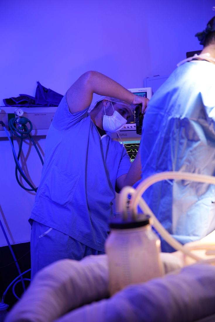 Juan filming a procedure in an operating room