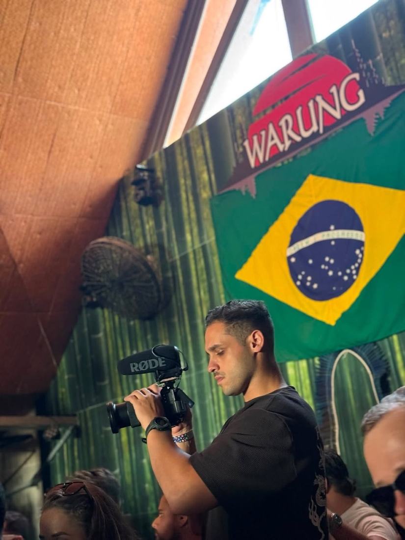 Juan wearing headphones, monitoring the recording