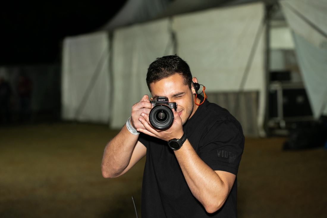 Juan taking photos with the camera pointed forward